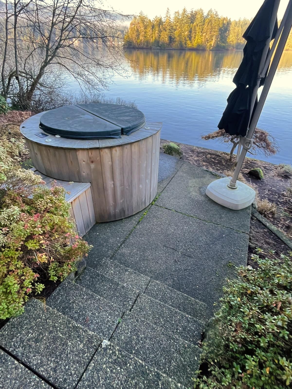 The six-person lakefront hot tub at golden hour