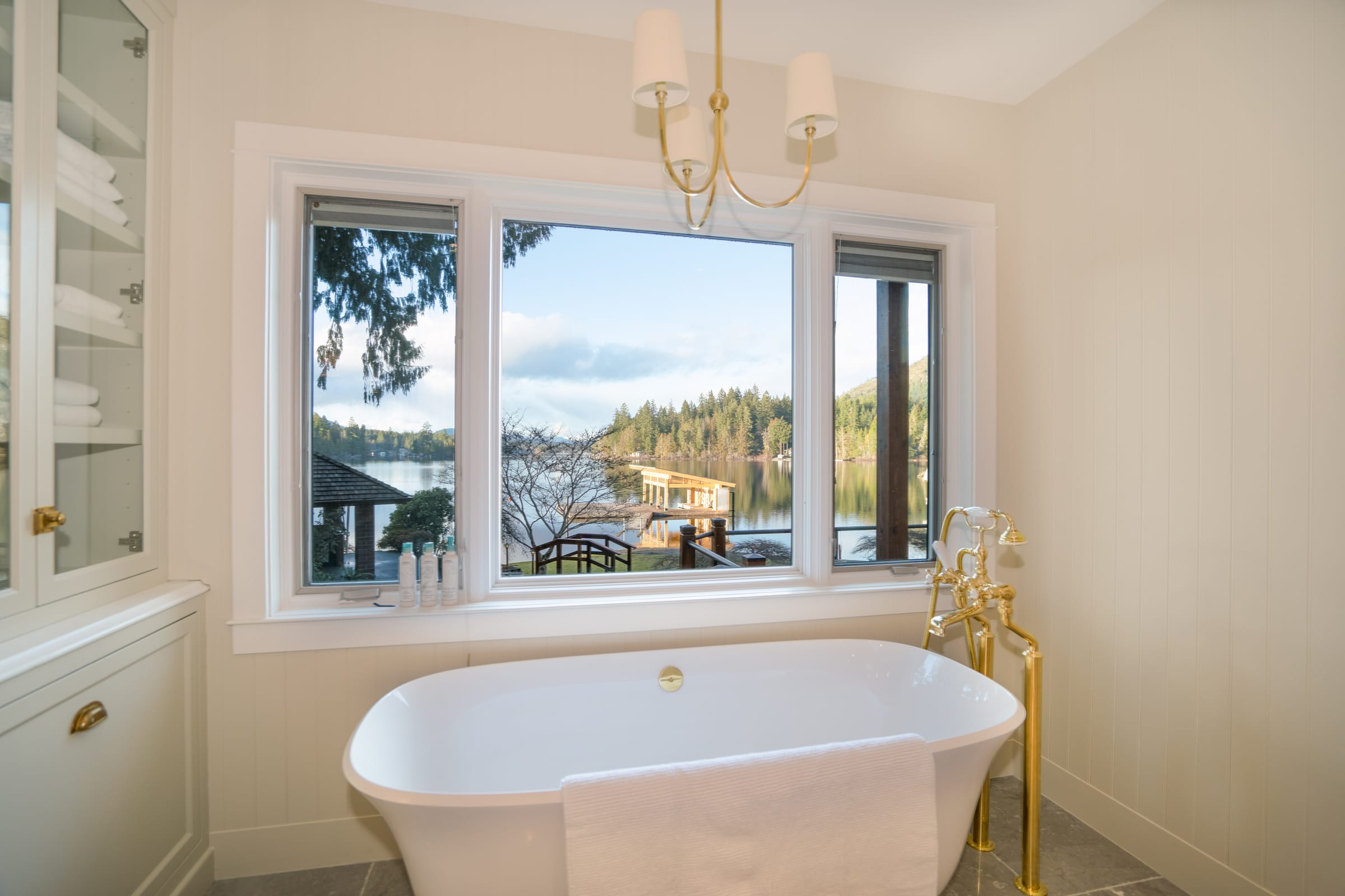 Spa bathroom with lake view tub